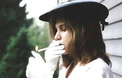 Erotic smoking ladies wearing gloves