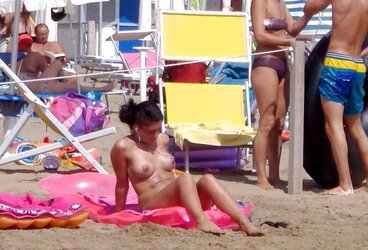 Dolls sunbathing on italian beach of the adriatic coast