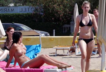 Dolls sunbathing on italian beach of the adriatic coast