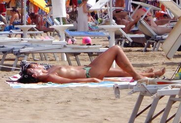 Dolls sunbathing on italian beach of the adriatic coast