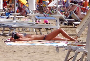 Dolls sunbathing on italian beach of the adriatic coast