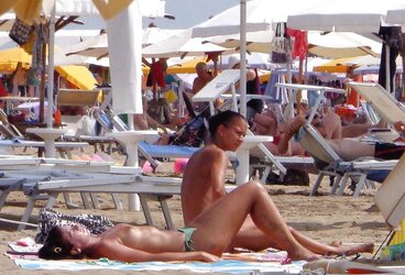 Dolls sunbathing on italian beach of the adriatic coast