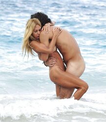 Shauna Sand having romp on the beach of St, Barth