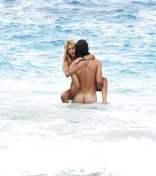 Shauna Sand having romp on the beach of St, Barth
