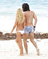 Shauna Sand having romp on the beach of St, Barth