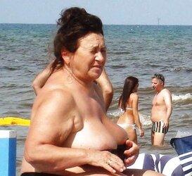 Older femmes sunbathing trio.
