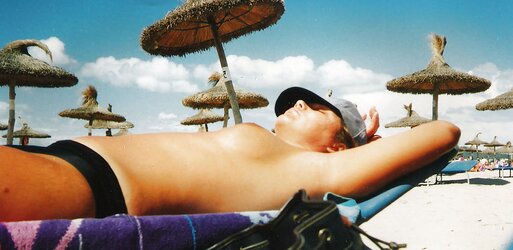 Teenager with phat bra-stuffers on the beach