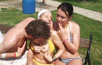 Femmes fooling around and showcasing knockers in a park