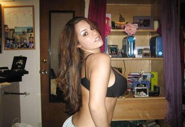 TEENAGER WITH GIGANTIC BRA-STUFFERS POSES
