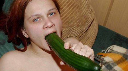 Super-Bitch plays with a cucumber